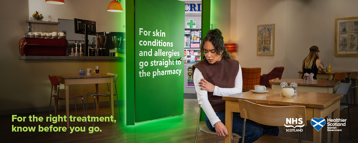 A woman with itchy arm and a doorway to pharmacy